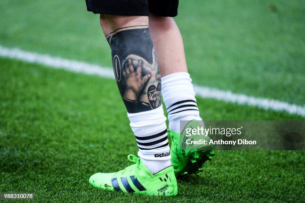 The tattooed leg of Lionel Messi of Argentina during the FIFA World Cup Round of 16 match between France and Argentina at Kazan Arena on June 30,...