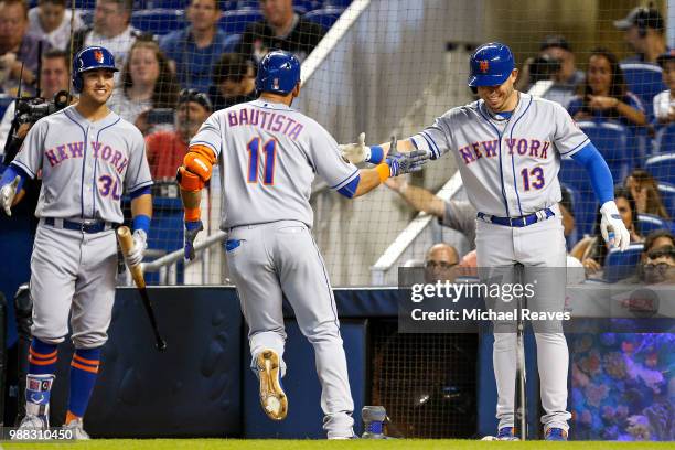 Jose Bautista of the New York Mets celebrates with Asdrubal Cabrera and Michael Conforto of the New York Mets after hitting a solo home run in the...