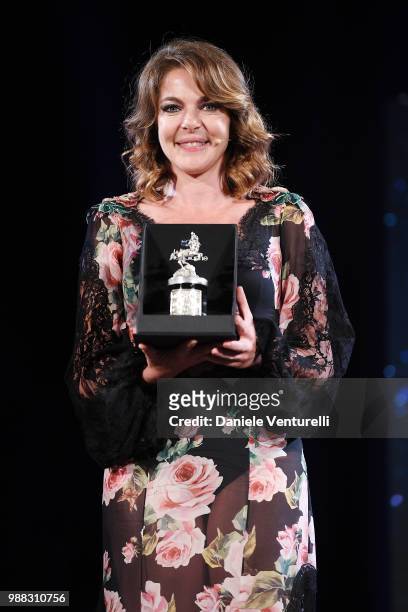 Claudia Gerini is awarded during the Nastri D'Argento Award Ceremony on June 30, 2018 in Taormina, Italy.