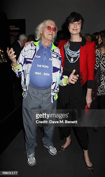 Former DJ and Top of The Pops presenter Sir Jimmy Savile and model Erin O'Connor attend the launch party for the "My Generation" Book Launch at the...