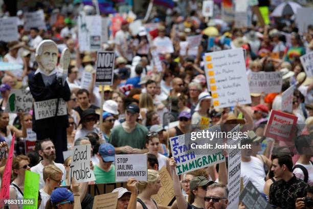 Demonstrators protest against Immigration and Customs Enforcement and the Trump administration's immigration policies at Daley Plaza, June 30, 2018...