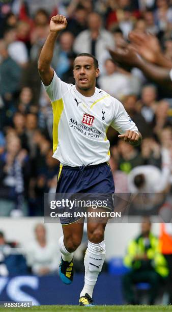 Tottenham's English midfielder Tom Huddlestone celebrates scoring the opening goal of the English Premier League football match between Tottenham...