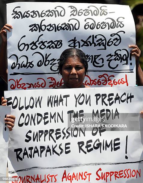 Sandhya Eknaligoda, the wife of missing cartoonist and political journalist Pradeep Eknaligoda, holds a placard protesting against her husbands...