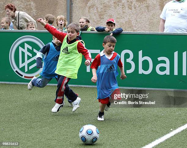 Pupils play soccer on one of the DFB mini soccer fields on the day of action under the slogan 'Mitspielen kickt! Starke Kinder, Wahre Champions' at...