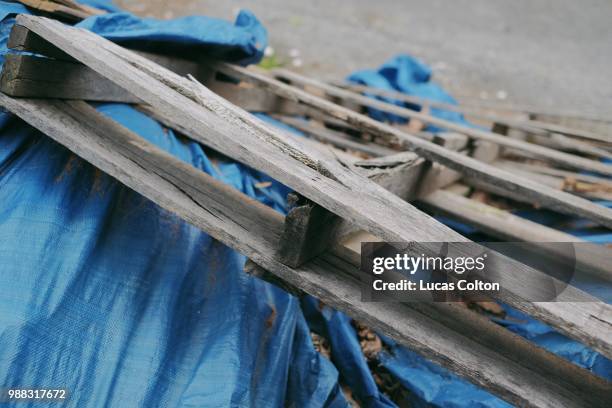 pallet and tarp - colyton stock pictures, royalty-free photos & images