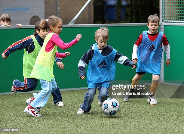 Pupils play soccer on one of the DFB mini soccer fields on the day of action under the slogan 'Mitspielen kickt! Starke Kinder, Wahre Champions' at...