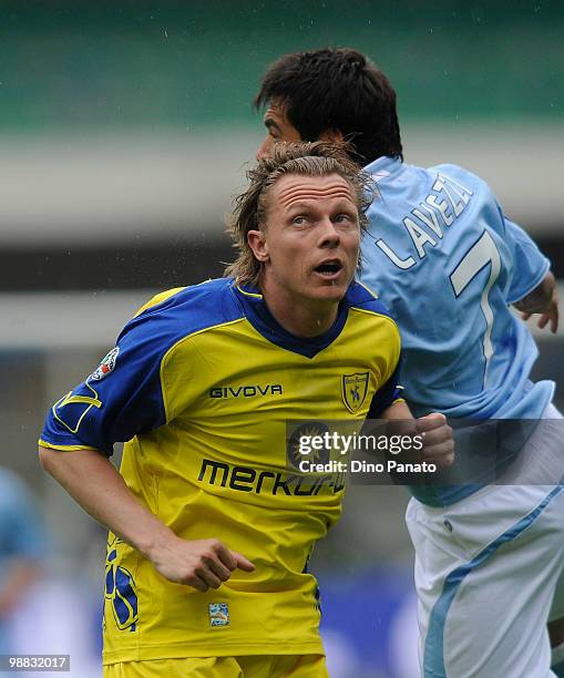 Ezequiel Lavezzi of Napoli competes with Nicolas Frey of Chievo during the Serie A match between Chievo and Napoli at Stadio Marc'Antonio Bentegodi...