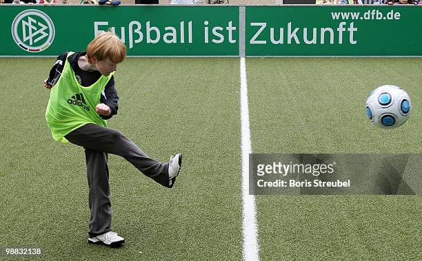 Pupils play soccer on one of the DFB mini soccer fields on the day of action under the slogan 'Mitspielen kickt! Starke Kinder, Wahre Champions' at...