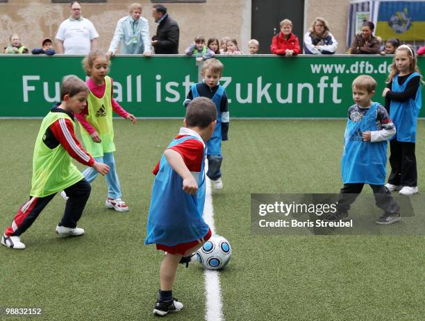 Pupils play soccer on one of the DFB mini soccer fields on the day of action under the slogan 'Mitspielen kickt! Starke Kinder, Wahre Champions' at...