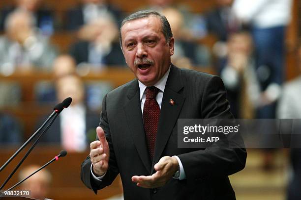 Turkish Prime Minister Tayyip Erdogan addresses parliament members of his ruling Justice and Developement Party at the Turkish Parliament in Ankara...