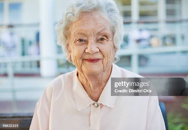 portrait of elderly woman smiling - newfamily stock pictures, royalty-free photos & images