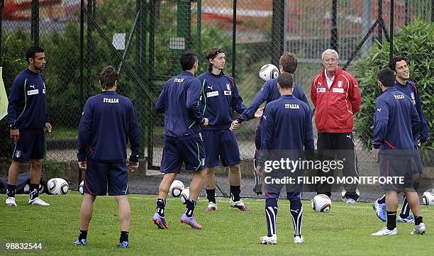 Italy's coach Marcello Lippi looks at his players during a training session of the Italian national football team on May 4, 2010 on the outskirts of...