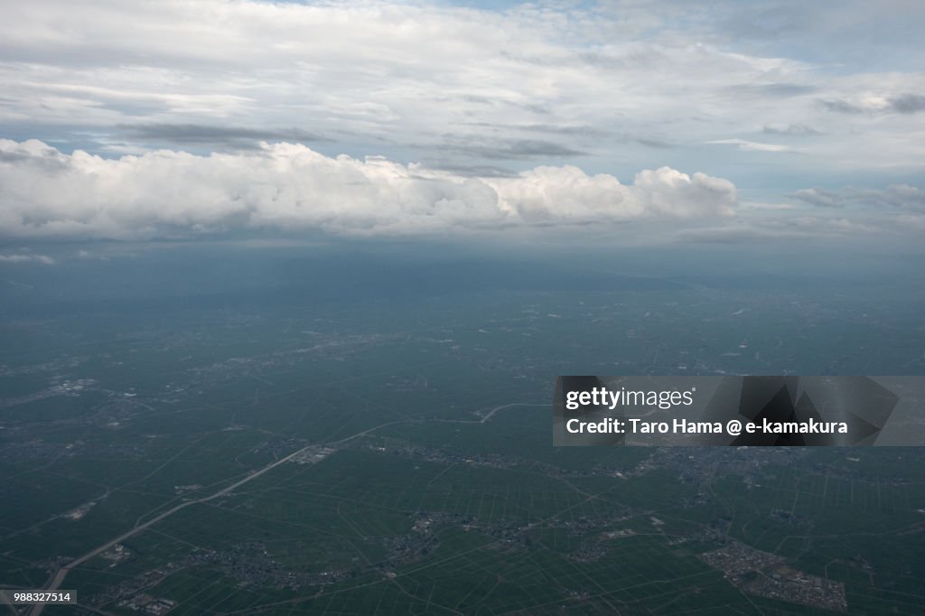Rice paddy and field in Niigata city in Japan sunset time aerial view from airplane