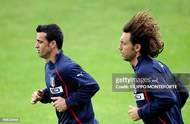 Italy's forward Antonio Di Natale and midfielder Andrea Pirlo warm up during a training session of the Italian national football team on May 4, 2010...