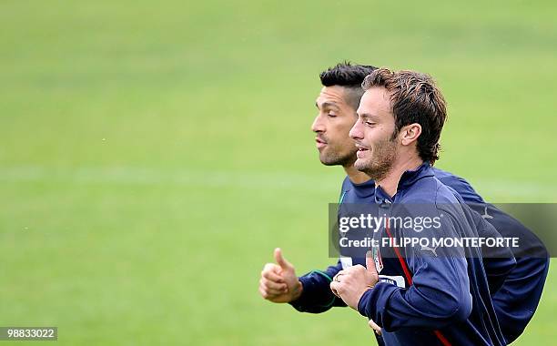 Italy's forwards Alberto Gilardino and Marco Borriello warm up during a training session of the Italian national football team on May 4, 2010 on the...