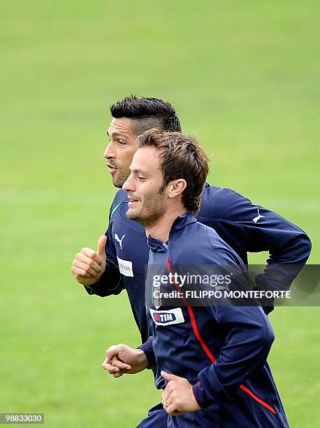 Italy's forwards Alberto Gilardino and Marco Borriello warm up during a training session of the Italian national football team on May 4, 2010 on the...