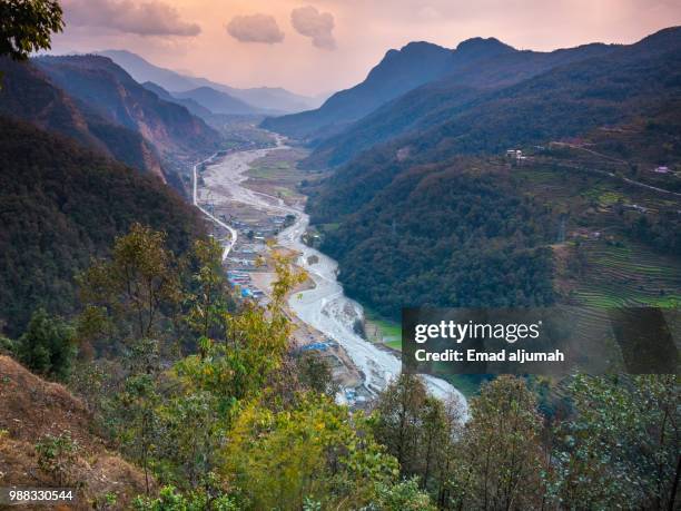 wonderful sunset over the foothills of the himalayas, nepal - machapuchare stock-fotos und bilder