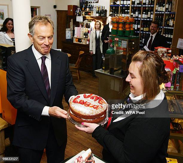 May 04: Former Prime Minister Tony Blair is given a cake by Alex Haigh, during a visit to the Rams Head Inn in Denshaw, in support of Phil Woolas,...