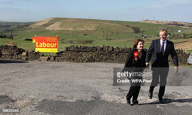 May 04: Former Prime Minister Tony Blair talks with Tracey Woolas, the wife of the Labour candidate for Oldham East and Saddleworth, during a visit...