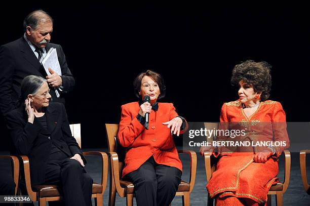 French actress Francoise Arnoul speaks to the audience flanked by actresses Italian Gina Lollobrigida and Christiane Minazzoli as French actor actor...