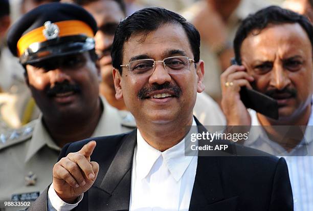 Special public prosecutor Ujjwal Nikam gestures as he speaks with media outside the special court at the Arthur Road Prison, where the 2008 Mumbai...