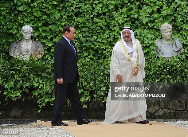Italy's prime minister Silvio Berlusconi greets the Emir of Kuwait Sheikh Sabah Al-Ahmad Al-Jaber Al-Sabah prior their meeting at Villa Madama on May...