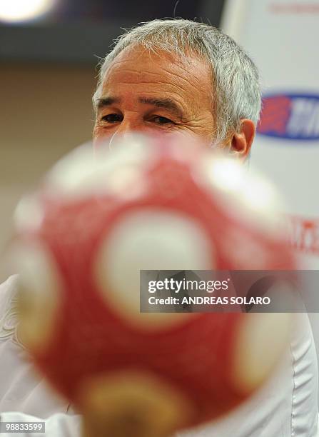 Roma coach Claudio Ranieri sits near the official Italian Cup ball as he answers questions during a press conference on May 4, 2010 at the Olimpico...