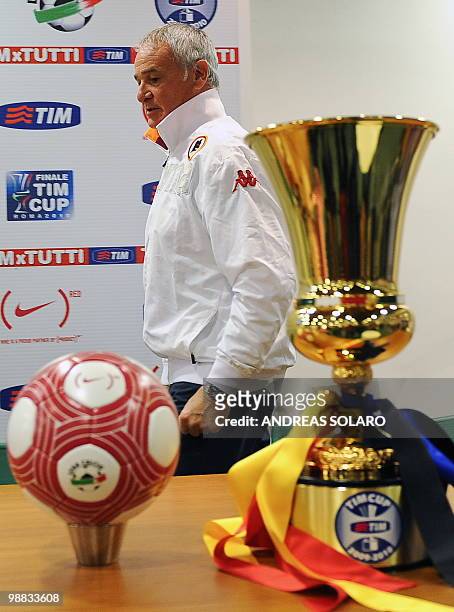 Roma coach Claudio Ranieri walks by the official Italian Cup ball and the Cup upon arrival for a press conference on May 4, 2010 at the Olimpico...
