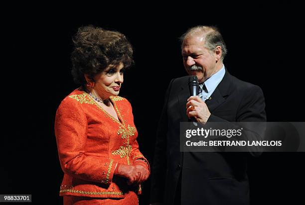 Italian actress Gina Lollobrigida listens to French actor Pierre Santini during a ceremony in hommage to French legend actor Gerard Philipe to...