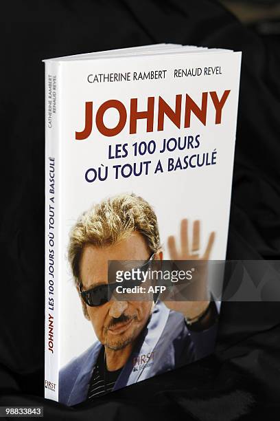 Picture taken on May 4, 2010 in Paris shows the book of French writers and journalists Catherine Rambert and Renaud Revel about French singer Johnny...