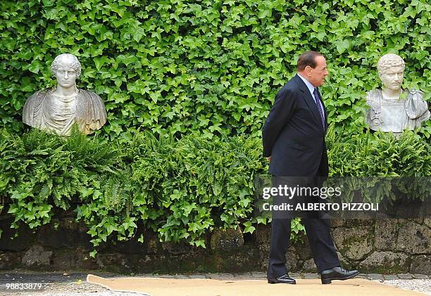 Italy's prime minister Silvio Berlusconi waits for the arrival of the Emir of Kuwait Sheikh Sabah Al-Ahmad Al-Jaber Al-Sabah for a meeting at Villa...