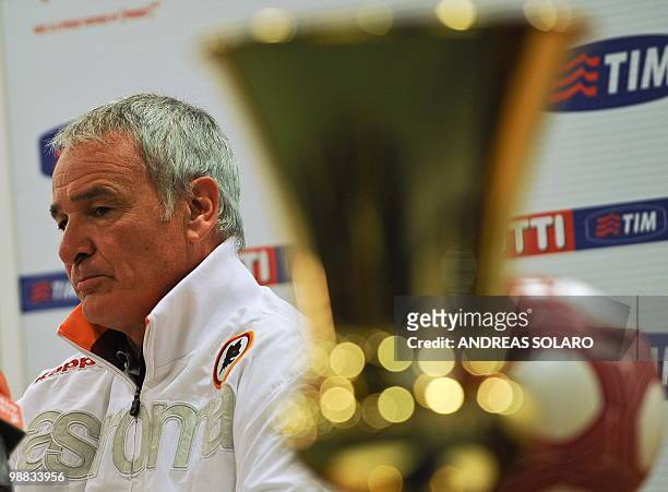 Roma coach Claudio Ranieri sits next to the Italian Cup during a press conference on May 4, 2010 at the Olimpico stadium in Rome. AS Roma will face...