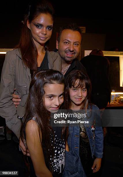 Make-up artist Napoleon Perdis poses with Aboriginal model Samantha Harris and guests backstage ahead of the Alex Perry collection show on the second...