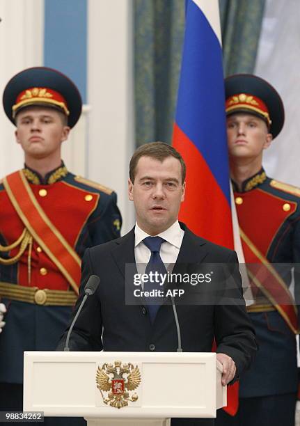 Russian President Dmitry Medvedev speaks during a ceremony to award "City of Military Glory" titles to city representatives at the Kremlin in Moscow...