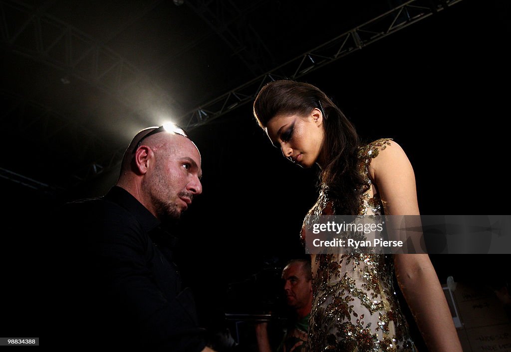 Images Alex Perry Designer Alex Perry sews a model into one of his dresses backstage ...