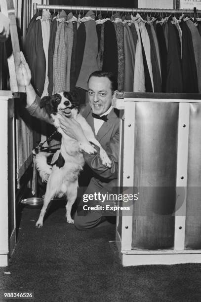 Pickles the collie dog pictured with his handler in the cloakroom at the 'Talk of the Town' venue in London on 19th April 1966. Pickles the dog shot...