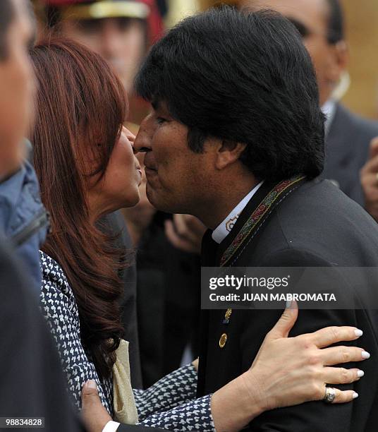 Bolivian President Evo Morales kisses his Argentine counterpart Cristina Fernandez de Kirchner before the opening session of the Union of South...