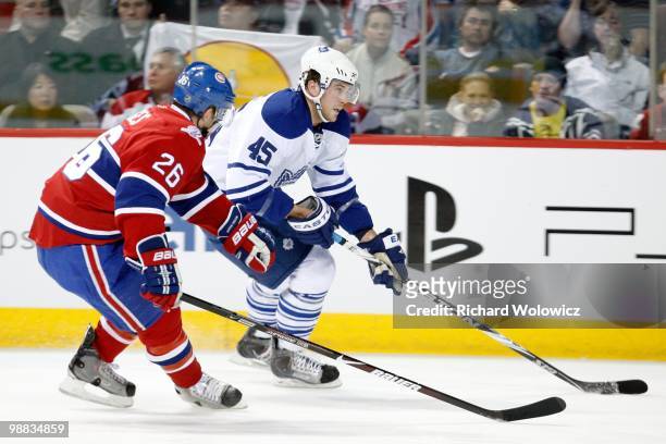 Viktor Stalberg of the Toronto Maple Leafs skates with the puck while being defended by Josh Gorges of the Montreal Canadiens during the NHL game on...