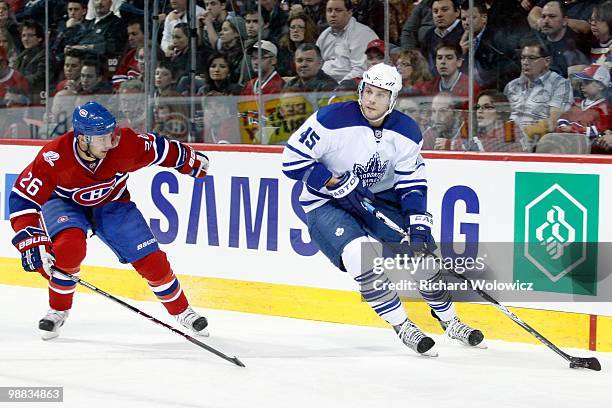 Viktor Stalberg of the Toronto Maple Leafs skates with the puck while being defended by Josh Gorges of the Montreal Canadiens during the NHL game on...