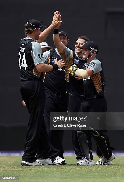 Nathan McCullum of New Zealand celebrates the wicket of Craig Ervine of Zimbabwe during the ICC T20 World Cup Group B match between New Zealand and...