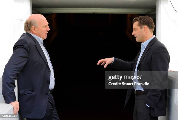 Dieter Hoeness, manager of Wolfsburg talks with Michael Zorc, manager of Dortmund during the Bundesliga match between Borussia Dortmund and VfL...