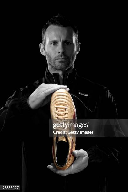 Ryan Giggs of Manchester United poses for a portrait session wearing the Reebok RG800 football boot on March 18, 2010 in Manchester, England.