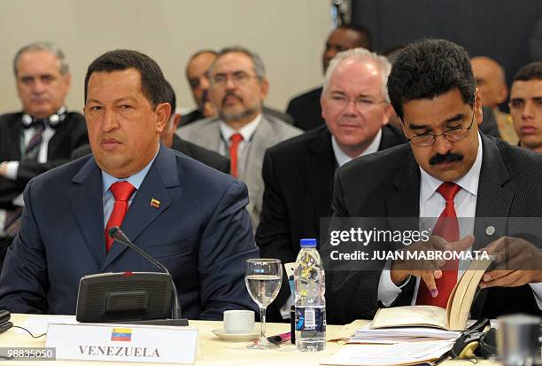 Venezuelan President Hugo Chavez and his Foreign Minister Nicolas Maduro attend the opening session of the Union of South American Nations...