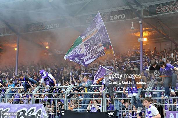 Fans of Aue celebrate to go to the 2. Bundesliga after winning the Third League match between Erzgebirge Aue and Eintracht Braunschweig at the...