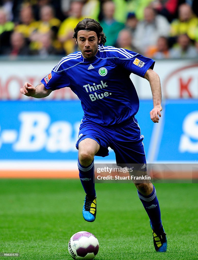 Andrea Barzagli of Wolfsburg runs with the ball during the Bundesliga