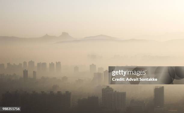 sunrise of winter - air pollution stock pictures, royalty-free photos & images