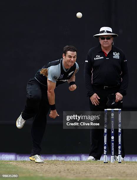 Nathan McCullum of New Zealand bowls a delivery during the ICC T20 World Cup Group B match between New Zealand and Zimbabwe at the Guyana National...
