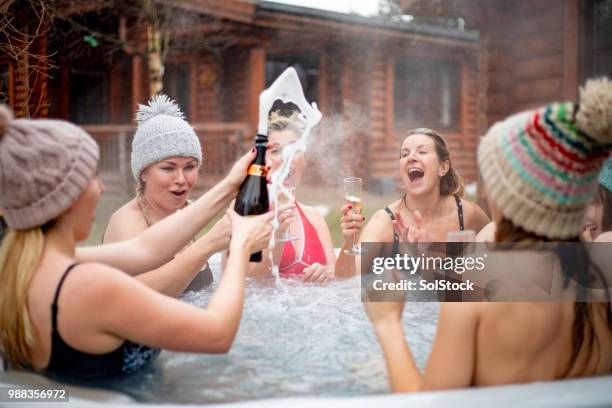 champagne in the hot tub with friends - hot tub party stock pictures, royalty-free photos & images