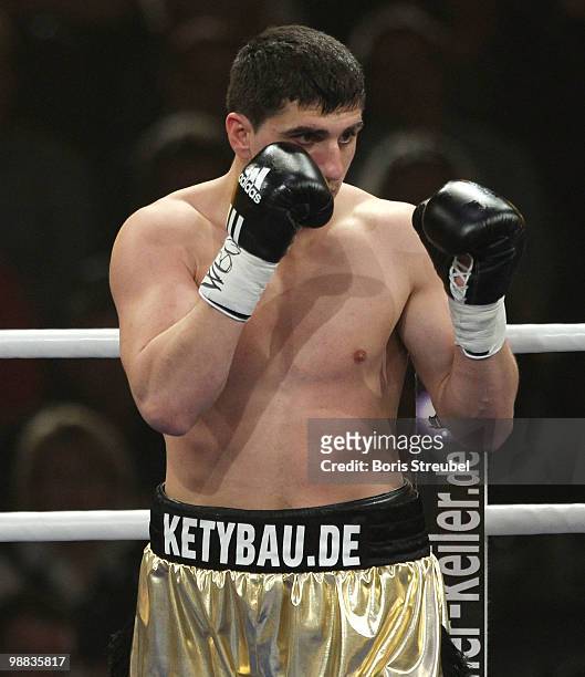 Marco Huck of Germany punches during his WBO World Championship Cruiserweight title fight against Brian Minto of the U.S.at the Weser-Ems-Halle on...
