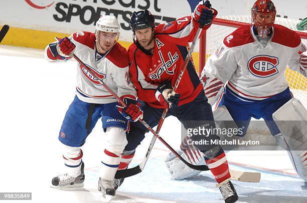 Mike Knuble of the Washington Capitals looks for a pass against Ryan O'Bryne of the Montreal Canadiens during Game Seven of the Eastern Conference...